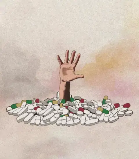 Hand surrounded by pills, drugs, addiction concept